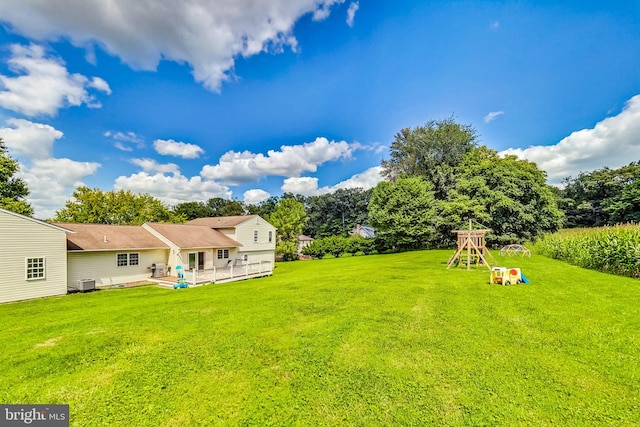 view of yard featuring central AC unit and a patio area