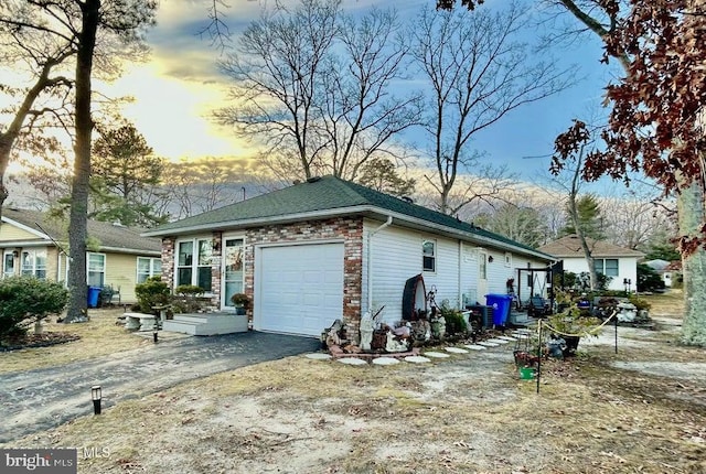 property exterior at dusk with a garage