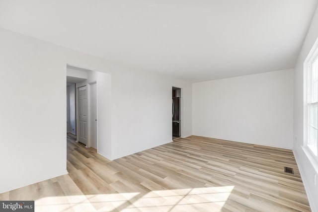 unfurnished room featuring light wood-type flooring