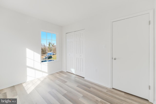 interior space featuring a closet and light wood-type flooring