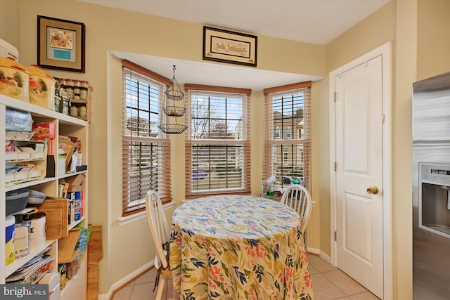 tiled dining area featuring plenty of natural light