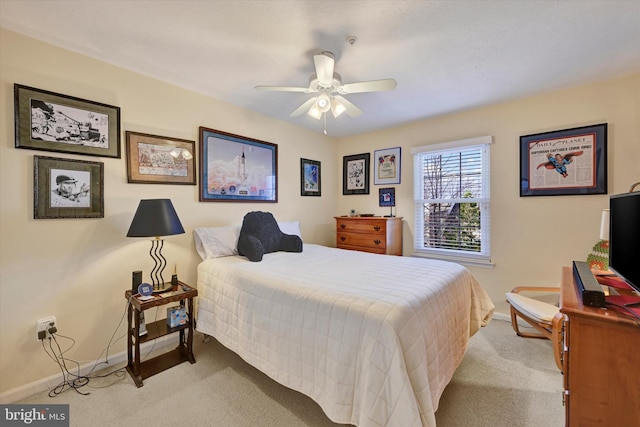 bedroom with ceiling fan and light colored carpet