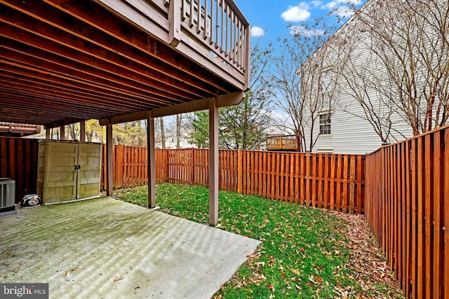 view of patio featuring a storage shed