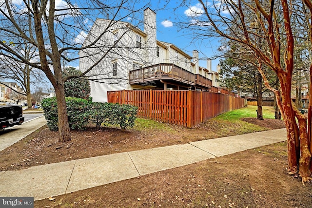 view of property exterior featuring a deck