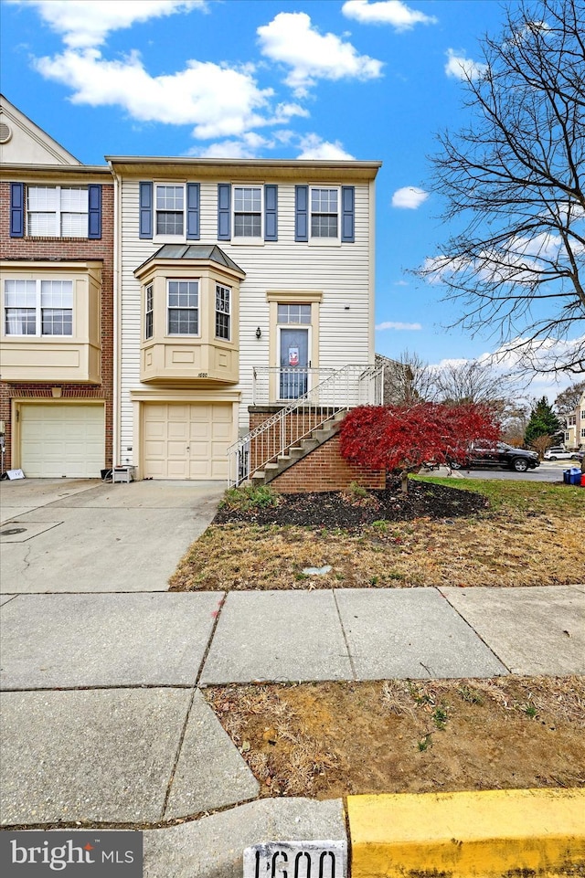 townhome / multi-family property featuring a garage