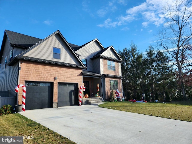 view of front of home with a garage and a front yard