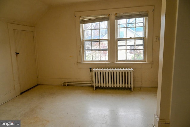 bonus room with radiator heating unit and lofted ceiling