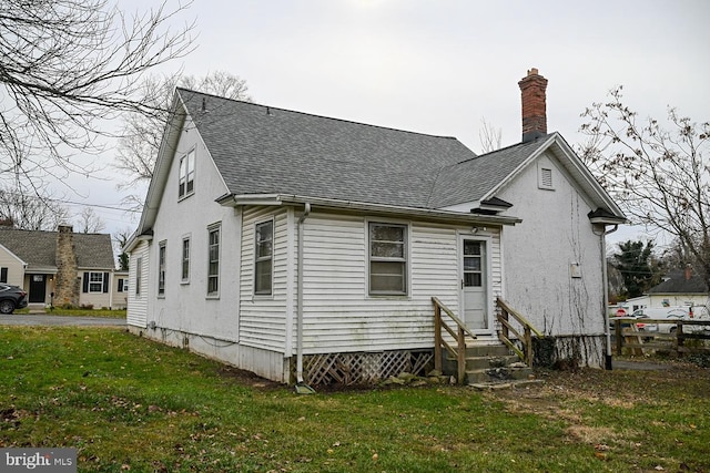 back of house with a yard