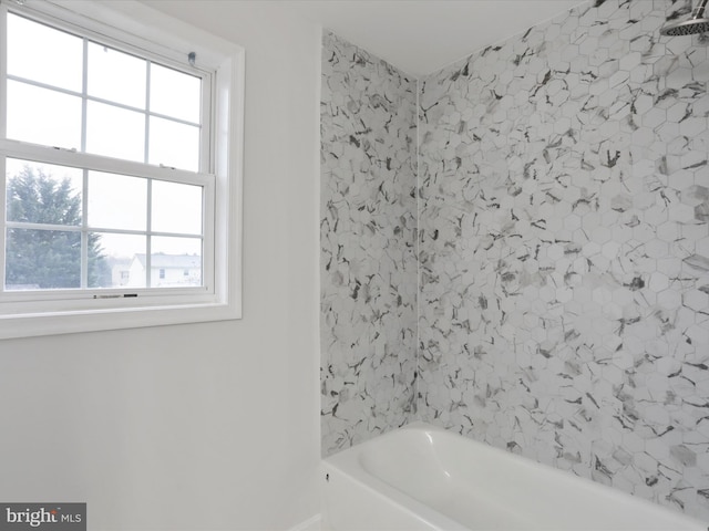 bathroom featuring a tub to relax in