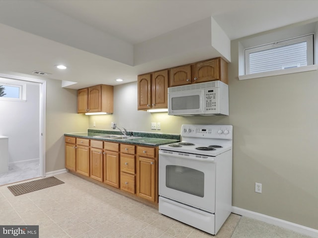 kitchen with sink and white appliances