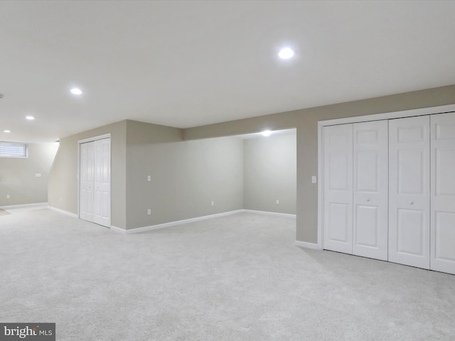 basement with light colored carpet