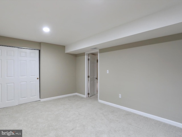 basement with light colored carpet