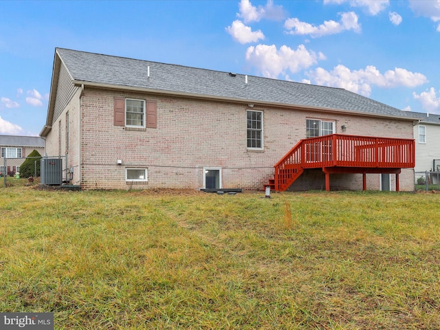 back of house featuring a yard, a deck, and cooling unit