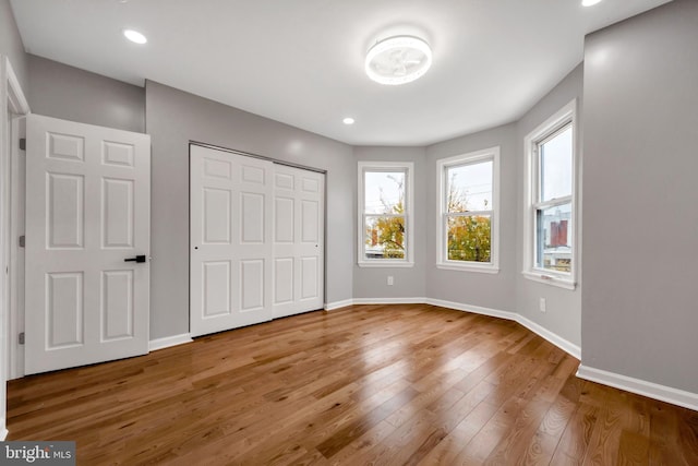 unfurnished bedroom with wood-type flooring