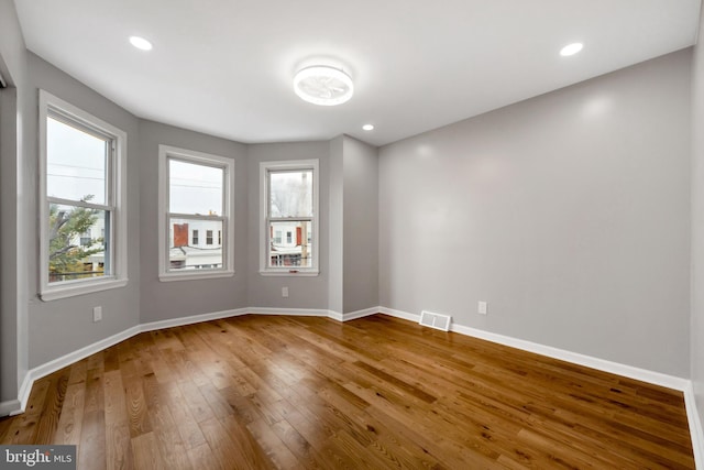 empty room with wood-type flooring