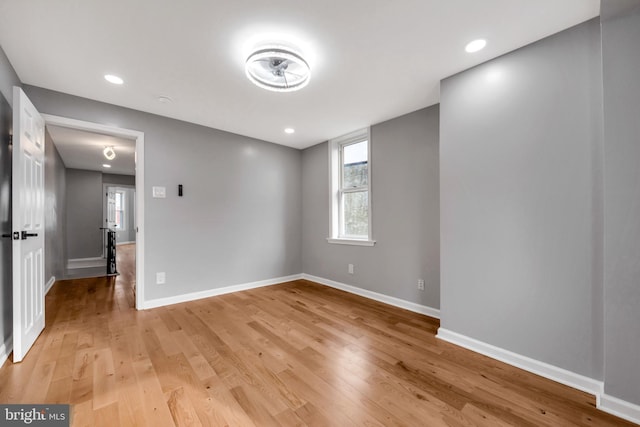 spare room featuring light hardwood / wood-style flooring