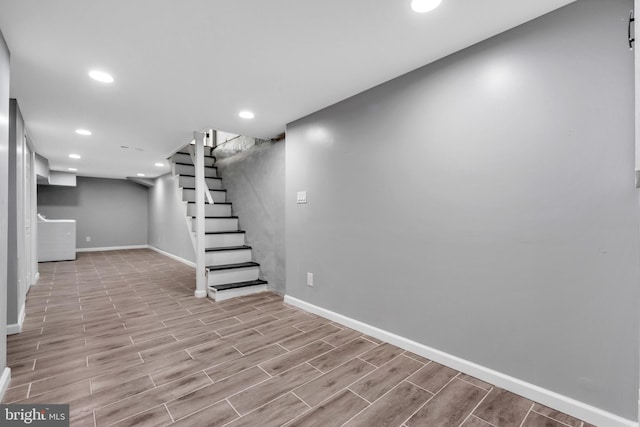 basement featuring light hardwood / wood-style floors