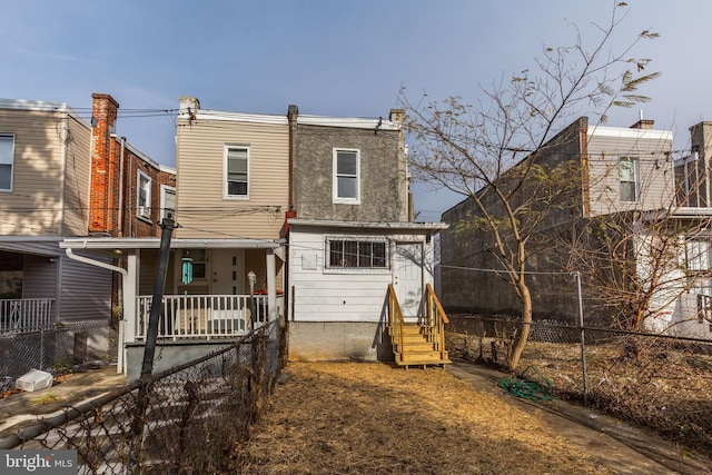 back of house with covered porch