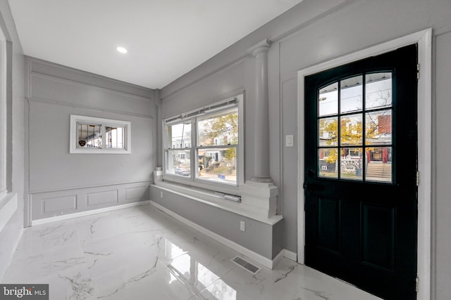 foyer featuring ornate columns