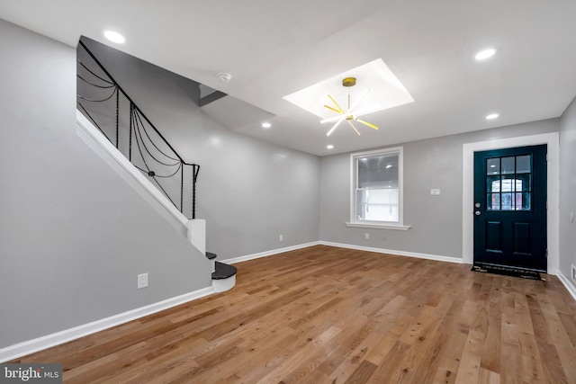 entryway featuring a chandelier and hardwood / wood-style floors