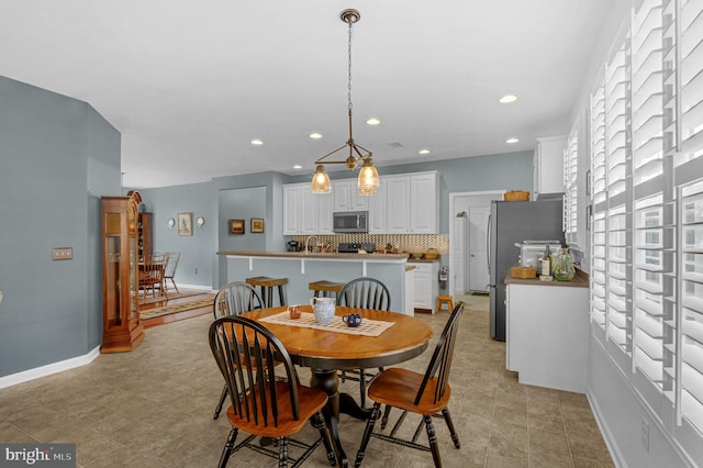 dining space with light tile patterned floors