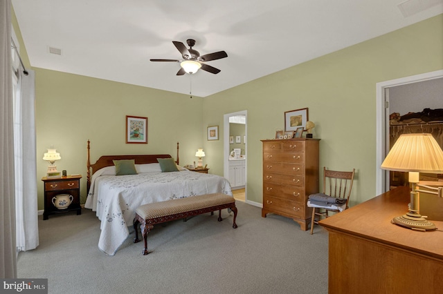 carpeted bedroom featuring connected bathroom and ceiling fan