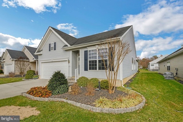 view of front of house featuring a garage and a front lawn