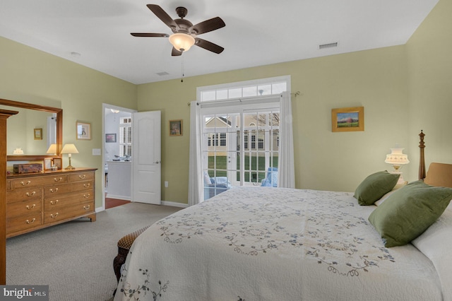 carpeted bedroom featuring access to exterior and ceiling fan