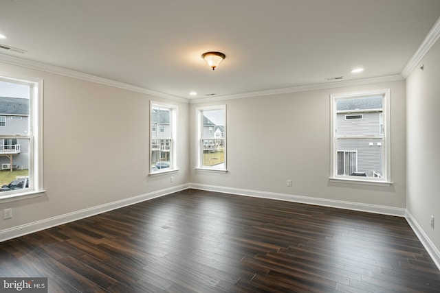 spare room with dark hardwood / wood-style flooring and crown molding