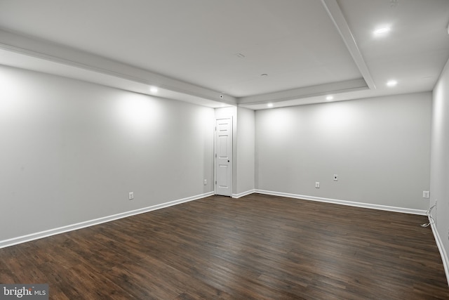 unfurnished room with dark hardwood / wood-style flooring