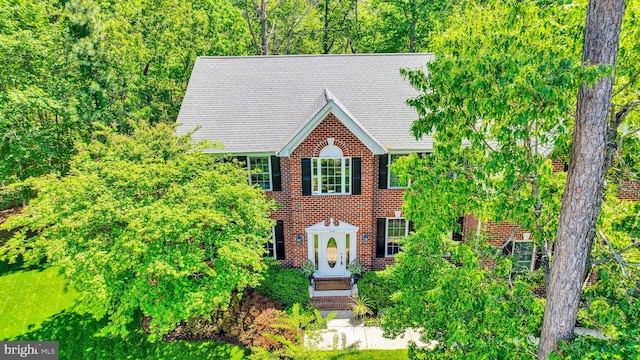 216 Pelagic Ln, Solomons, MD 20688 - view of front facade with roof with shingles and brick siding