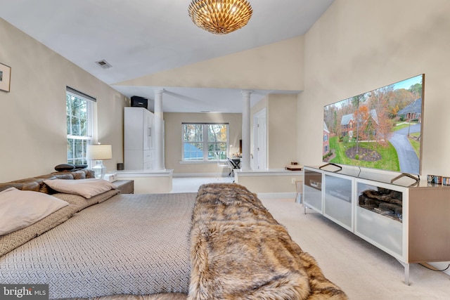 216 Pelagic Ln, Solomons, MD 20688 - bedroom featuring decorative columns, light colored carpet, lofted ceiling, and baseboards