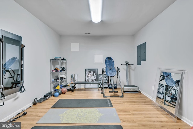 216 Pelagic Ln, Solomons, MD 20688 - workout area featuring wood finished floors, baseboards, and electric panel
