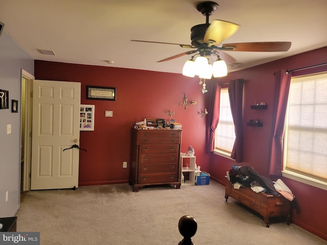 bedroom featuring ceiling fan and light colored carpet