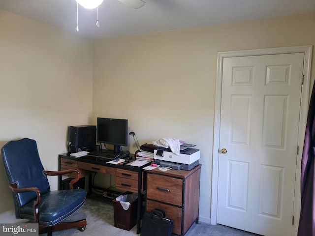 office area featuring ceiling fan and light carpet