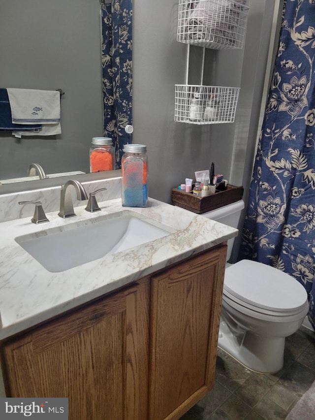 bathroom with vanity and toilet