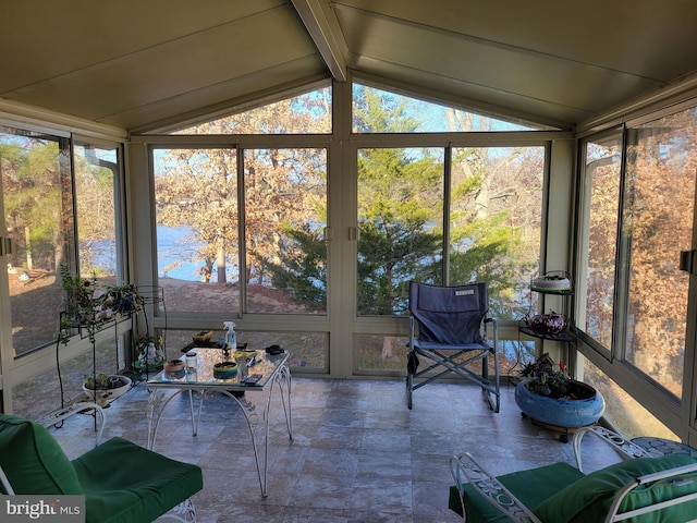 sunroom with lofted ceiling with beams