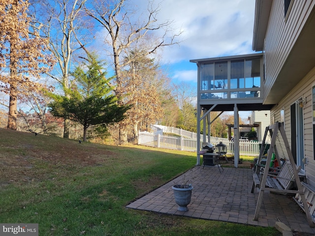 view of yard with a patio area and a sunroom