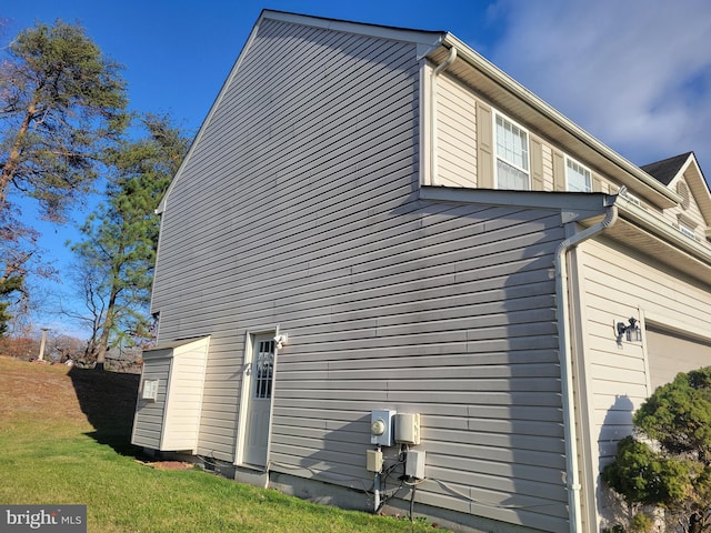 view of property exterior featuring a garage