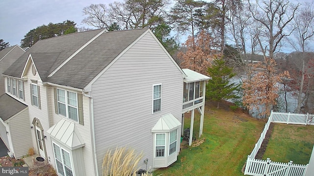 view of side of home with a sunroom