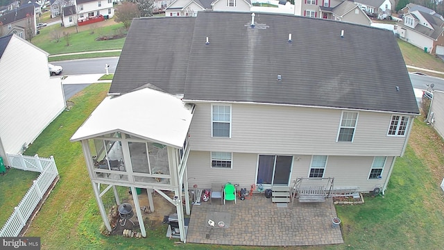 back of house with a patio