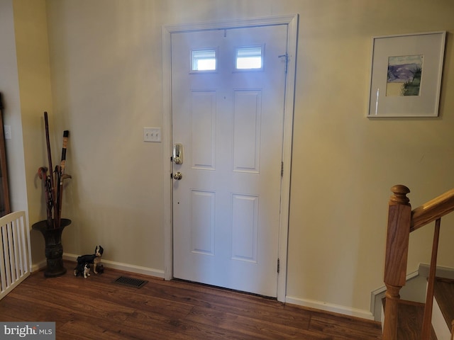 foyer entrance with dark hardwood / wood-style flooring