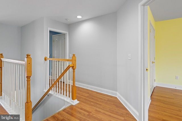 hall with light hardwood / wood-style flooring