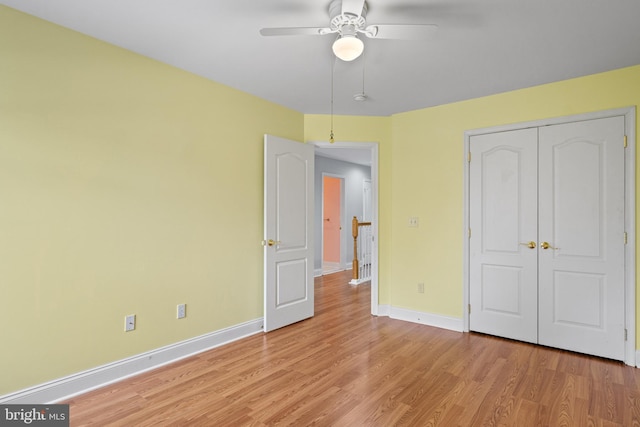 unfurnished bedroom featuring a closet, ceiling fan, and light hardwood / wood-style flooring