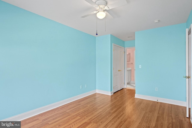 unfurnished bedroom with ceiling fan, a closet, and light hardwood / wood-style flooring