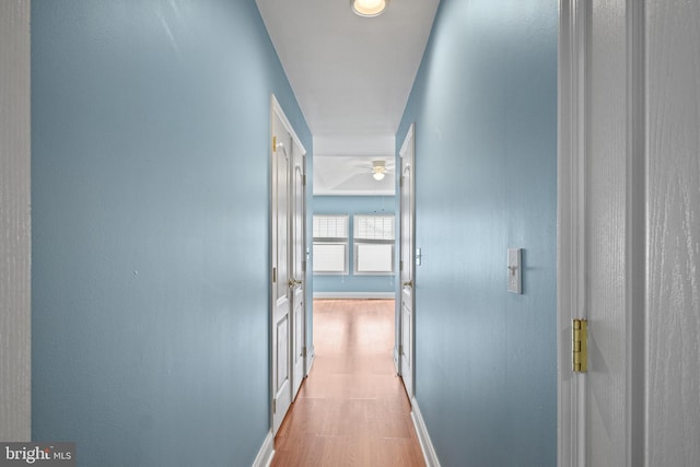 hall with light hardwood / wood-style floors