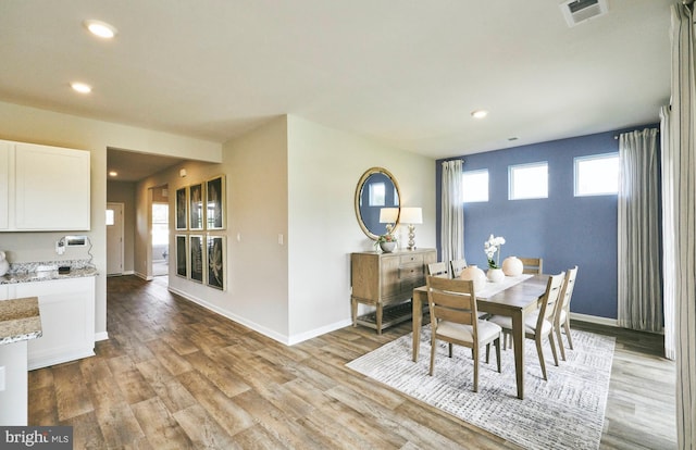 dining space featuring light hardwood / wood-style floors