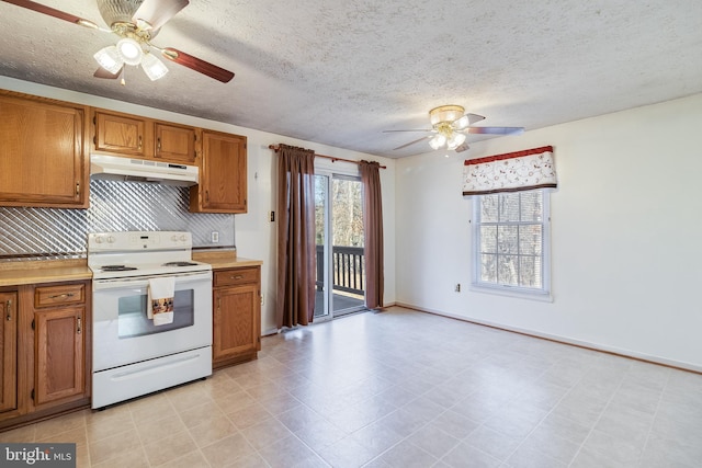 kitchen featuring a textured ceiling, tasteful backsplash, white range with electric stovetop, and ceiling fan