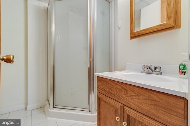 bathroom with vanity, tile patterned floors, and walk in shower