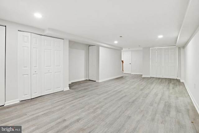 basement with light wood-type flooring